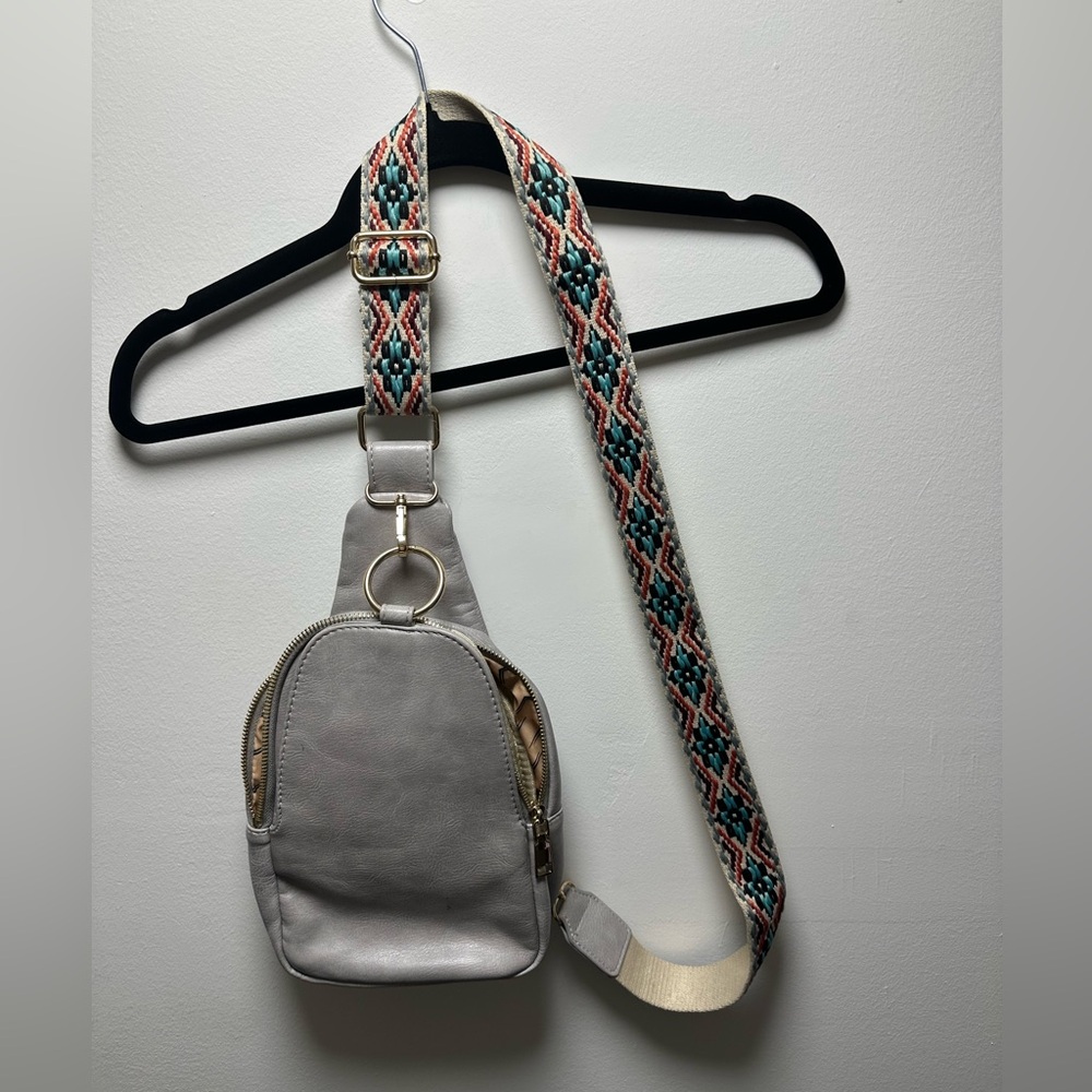 Gray Crossbody Bag with Patterned Strap.